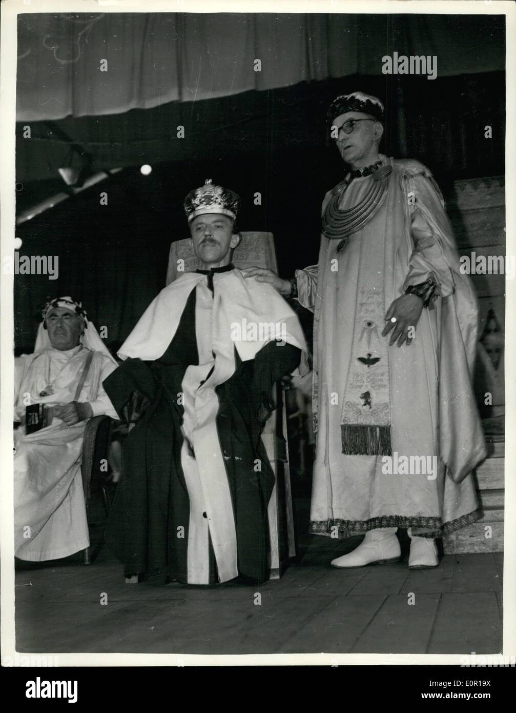 Aug. 08, 1957 - Bardic Crown Awarded To B.B.SC. Man At The Llangefni Eisteddfod.Mr. Dyfnallt Morgan, 40-year-old producer who is on the Welsh Staff of the B.B.C. at Bangor, was yesterday awarded the Bardic Crown at the Eisteddfod at Llangefni, for a verse play entitled ''Between Two''. Photo Shows Mr. Dyfnallt Morgan, seen after being crowned by the Arch-Druid. The Rev. William Morris, at Llangefni yesterday. Stock Photo