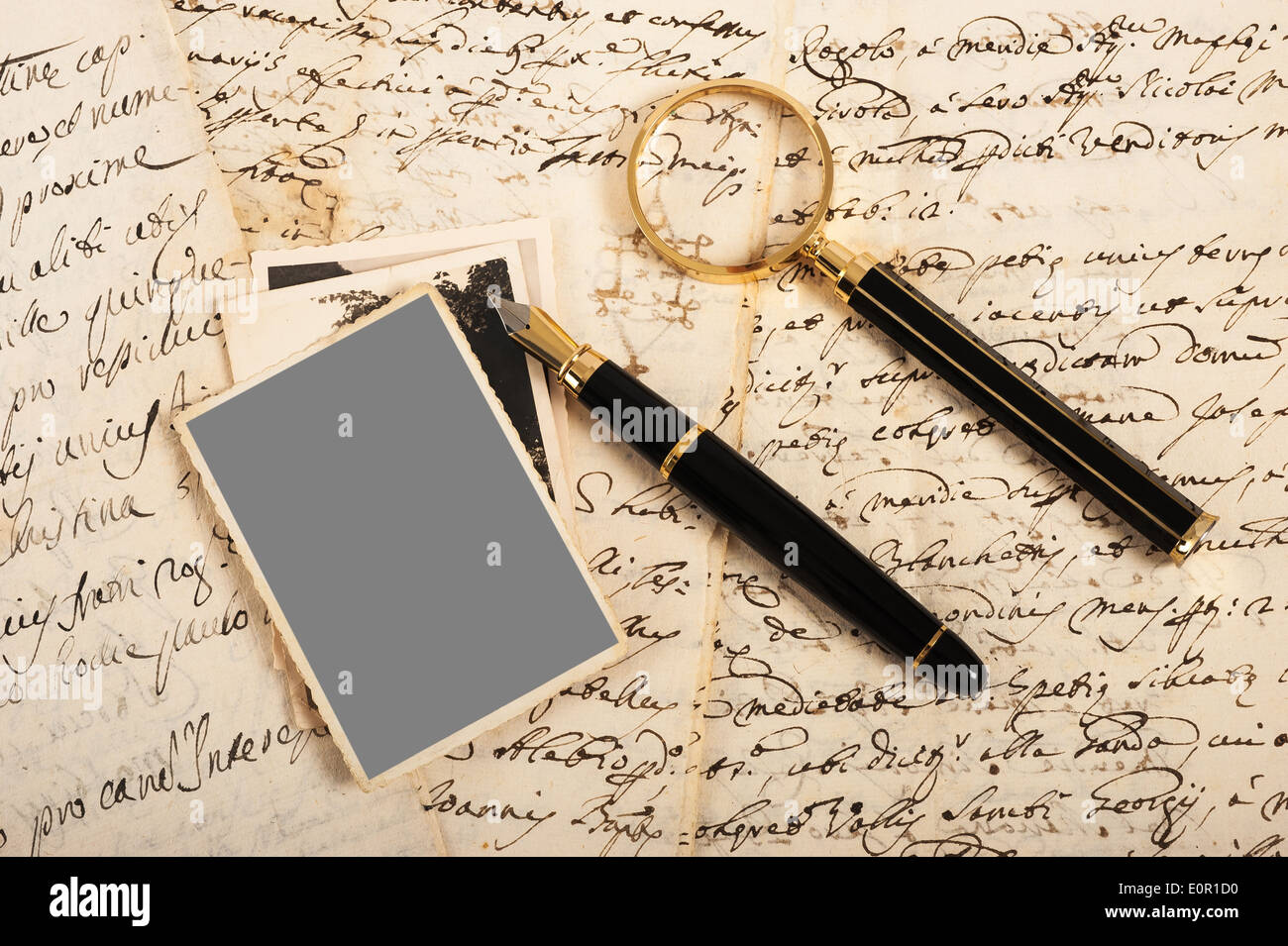 Picture and letters with fountain pen and magnifying glass Stock Photo