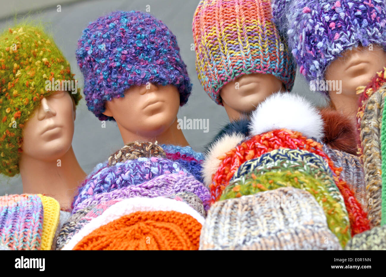 Colorful hand knitted hats on street sale Stock Photo