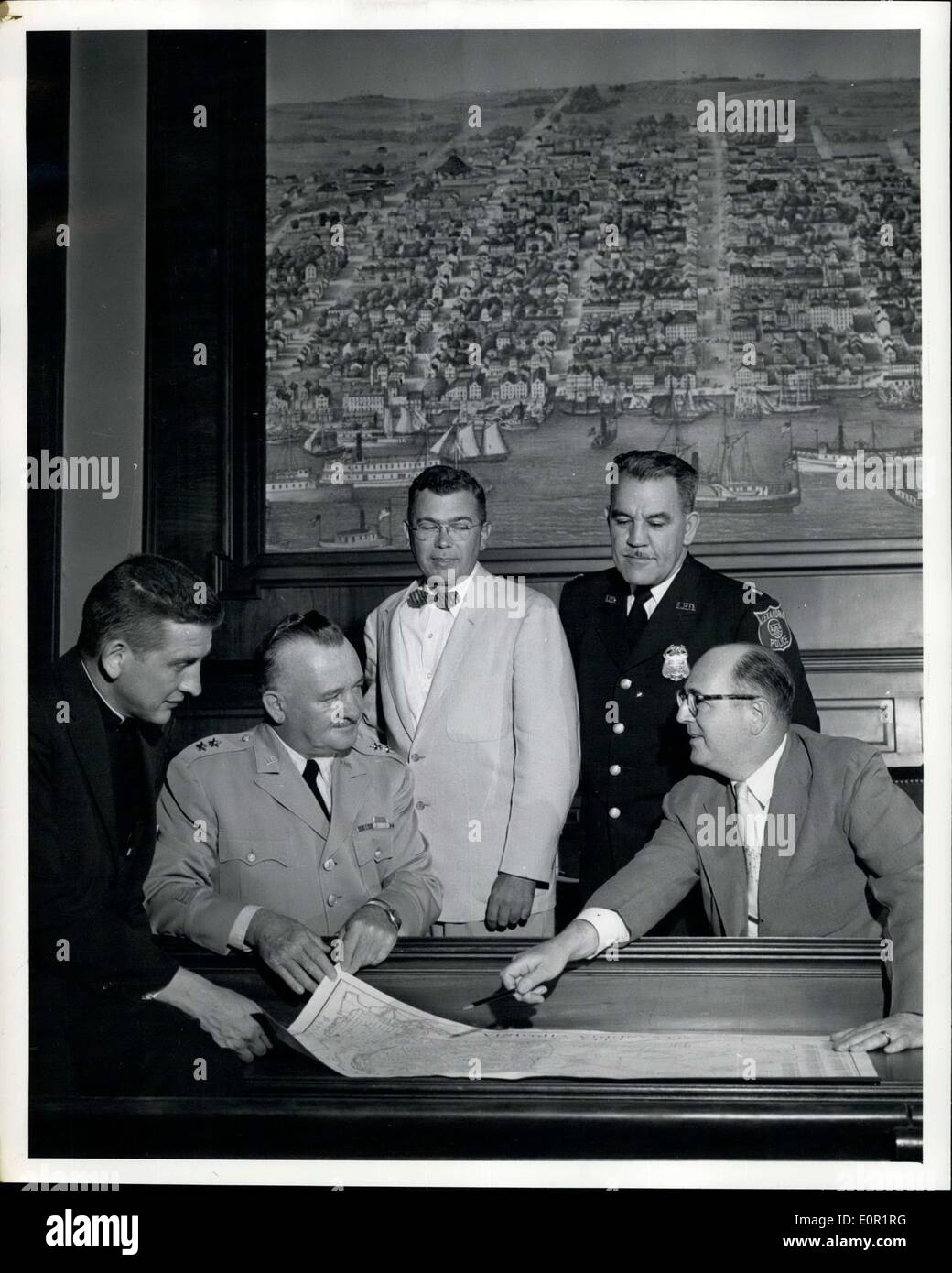 Sep. 20, 1957 - Major General David H. Tully, second from left, commanding general, the engineer center, Fort Belvoir, holds one of his periodic conferences with city officials in the council chamber at Alexandria, Virginia. They discuss subjects and activities of mutual interest. Left to right are Reverand Kenneth G. Phifer, a Presbyterian Minister. General Tully, city manager E.G. Heatwole, police chief Russel A Hames and Mayor Leroy S. Bendheim. Stock Photo