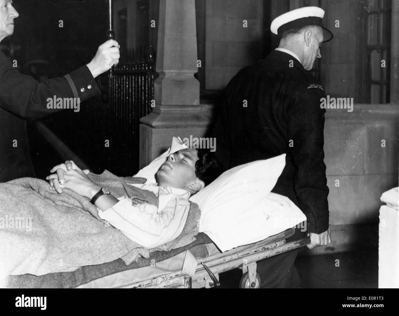 Tarquin Olivier on a stretcher being carried into West Hill Hospital Stock Photo