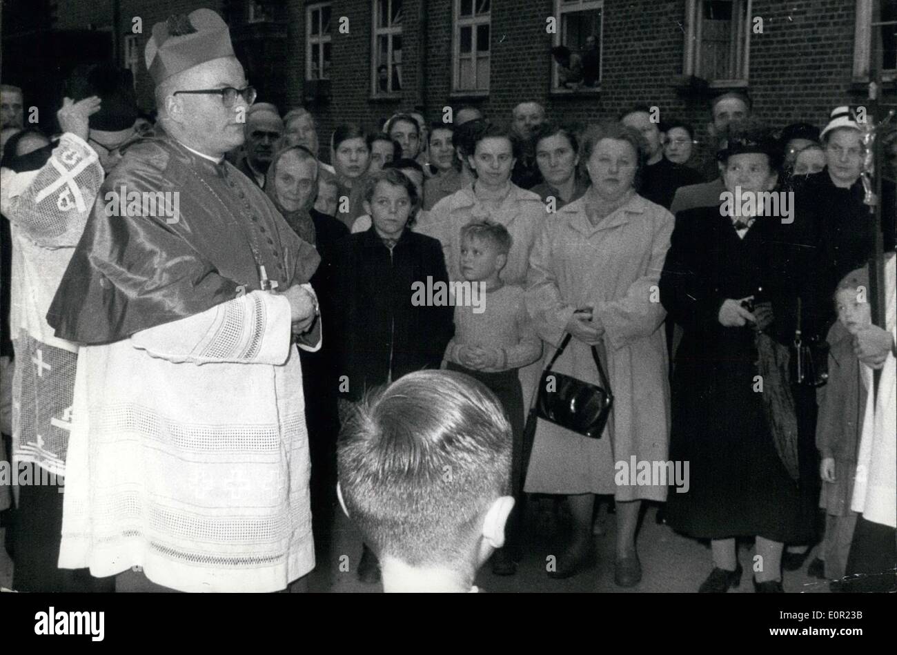 Oct. 10, 1957 - The largest refugee-camp of Europe... In Wentorf near Hamburg a visit was payed on Oct 5, 1957 by the new Bishop of Osnabrueck, Dr. Wittler, who celebrated a pontifical mass in the chapel of the camp. This visit - payed on the third day after being ordained bishop of Osnabrueck - shows the affection of Dr. Wittler towards the refugees who bear such heavy burden. The camp Wentorf has at present a population of approx. 10000 refugees and expels who are awaiting their admission by the Nordrhein-Wesfalia authorities. OPS:- Bishop Dr. Wittler at Camp Wentorf. Stock Photo