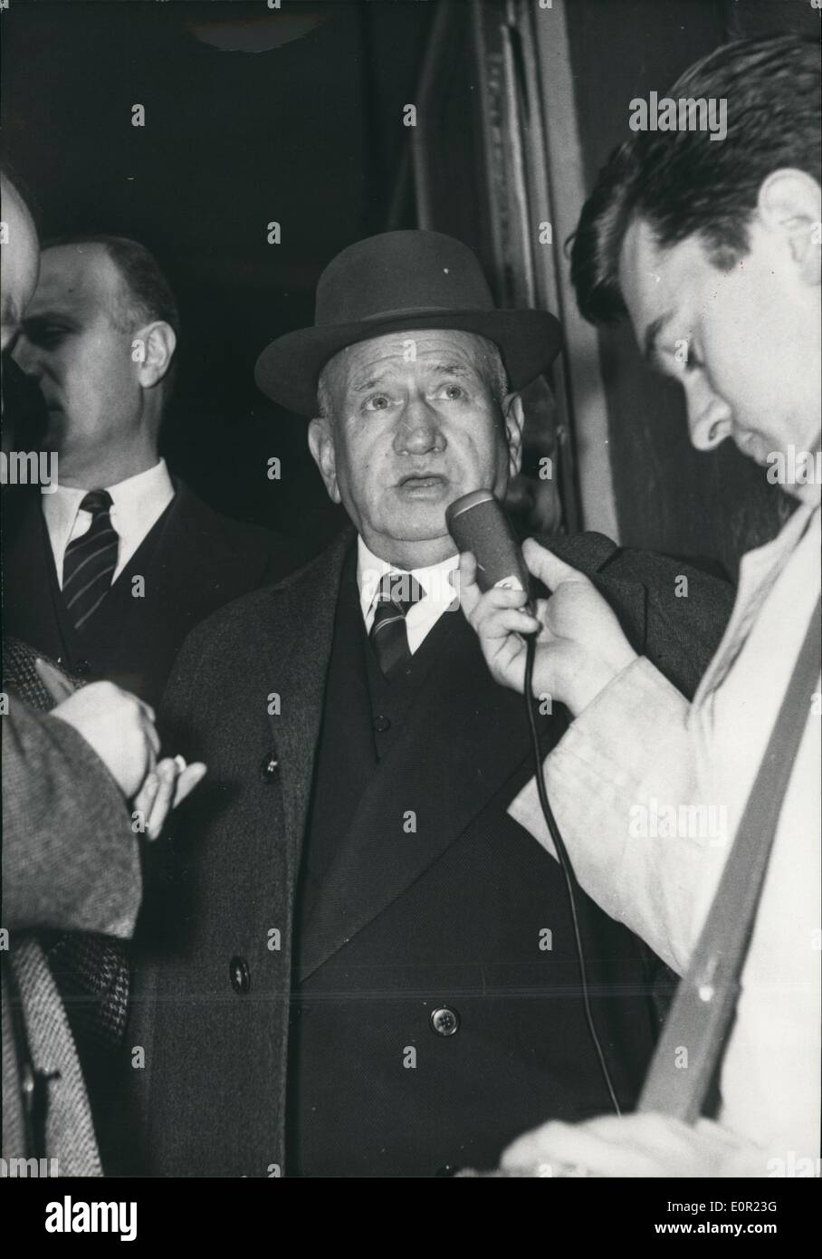 Oct. 10, 1957 - Cabinet Crisis: Photo shows M. Edouard Daladier leaving the ministry of Public works where M. Rene Pleven is carrying in his political Negotiations endeavoring to find a workable majority enabling him to form a new Government. Stock Photo