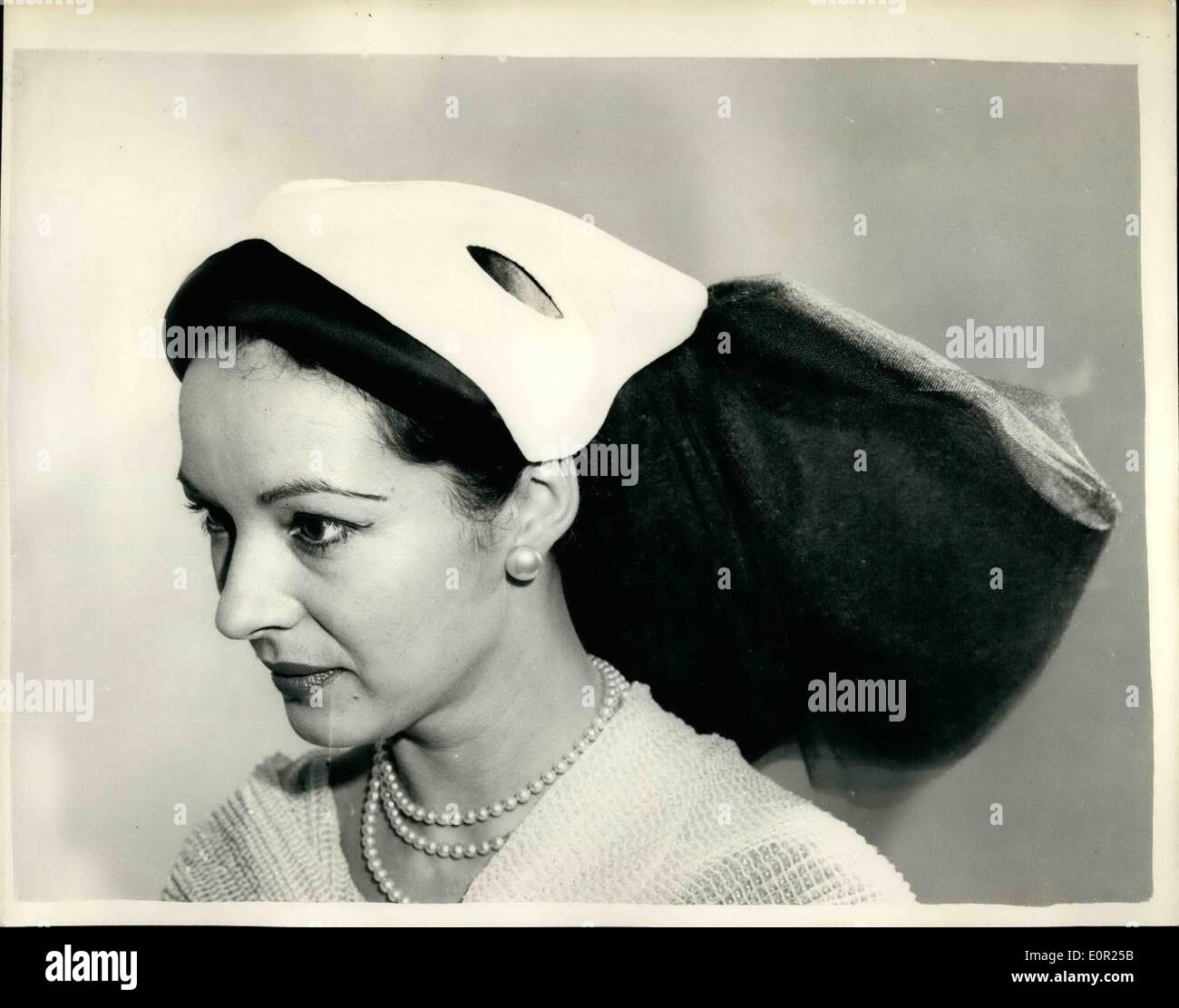 Oct. 10, 1957 - Hats for the winter - on show in London: The Domino like style: hoto shows : Olga displays 'infants'' Stock Photo