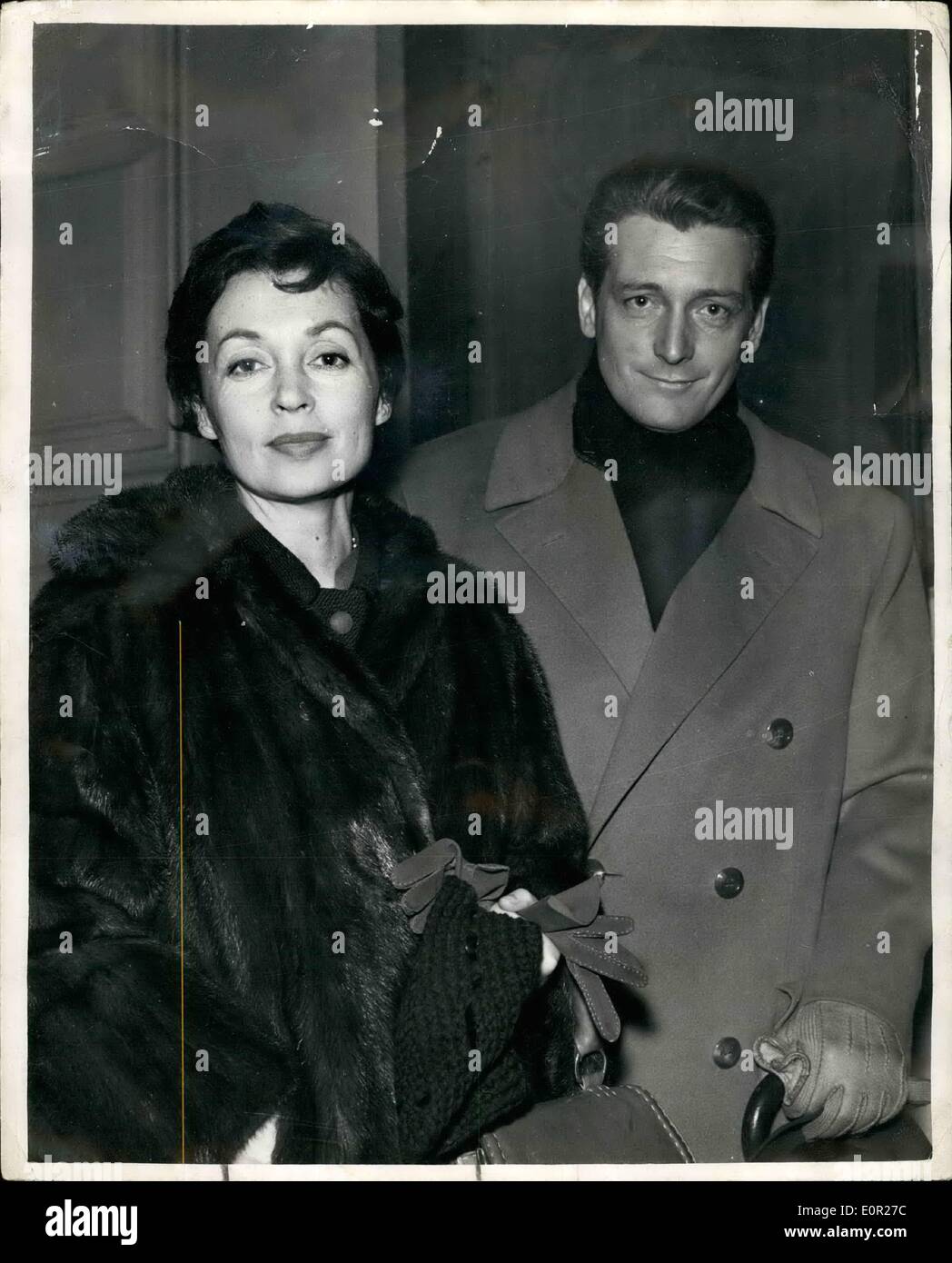 Dec. 12, 1957 - Lilli Palmer Flies in with Her New Husband. Actress Lilli Palmer a former wife of Rex Harrison - flew into London last night with the man she married in September... Argentinian actor Carlos Thompson. It is their first visit to Britain together and they are to spend Christmas with Lilli's sister, Mrs. Hilde Schnitzer. Stock Photo