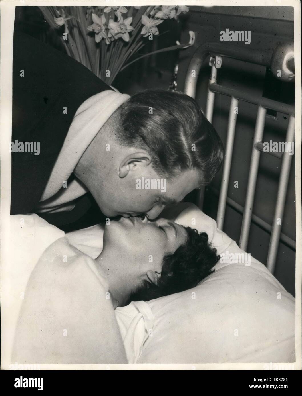 Dec. 12, 1957 - Couple Re-United In Lewisham Hospital - After Tragic Rail Disaster.. One of the Victims of the Lewisham train disaster - was 24 year old Mrs. Josephine Taylor of Beckenham, Kent.. She was trapped in the wreckage her legs were torn and broken.. While she was being rescued from the tangles mass of smashed coaches and the bodies of fellow passengers - she was worrying about her husband Ken - who she thought might have been on the same train... The couple were reunited yesterday in Lewisham hospital - and in spite of her terrible injuries Josephine was happy once again. Stock Photo