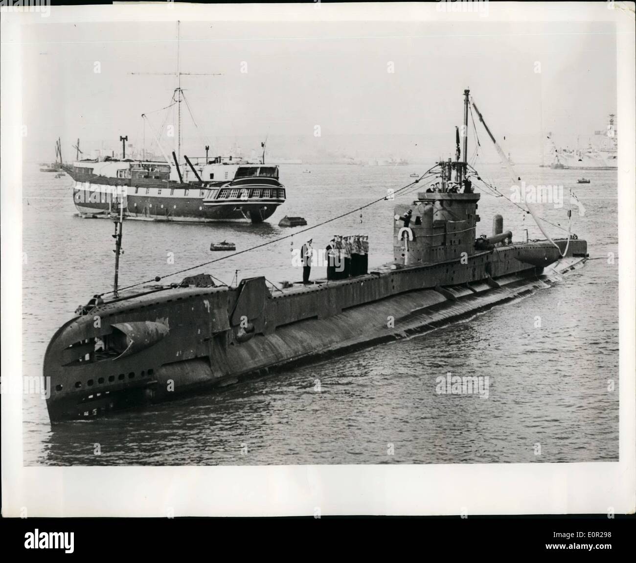 Dec. 12, 1957 - Round-The -world Submarine Home after eight years: H.M.S. Through (1,090 Long tons) is believed to be the first Stock Photo