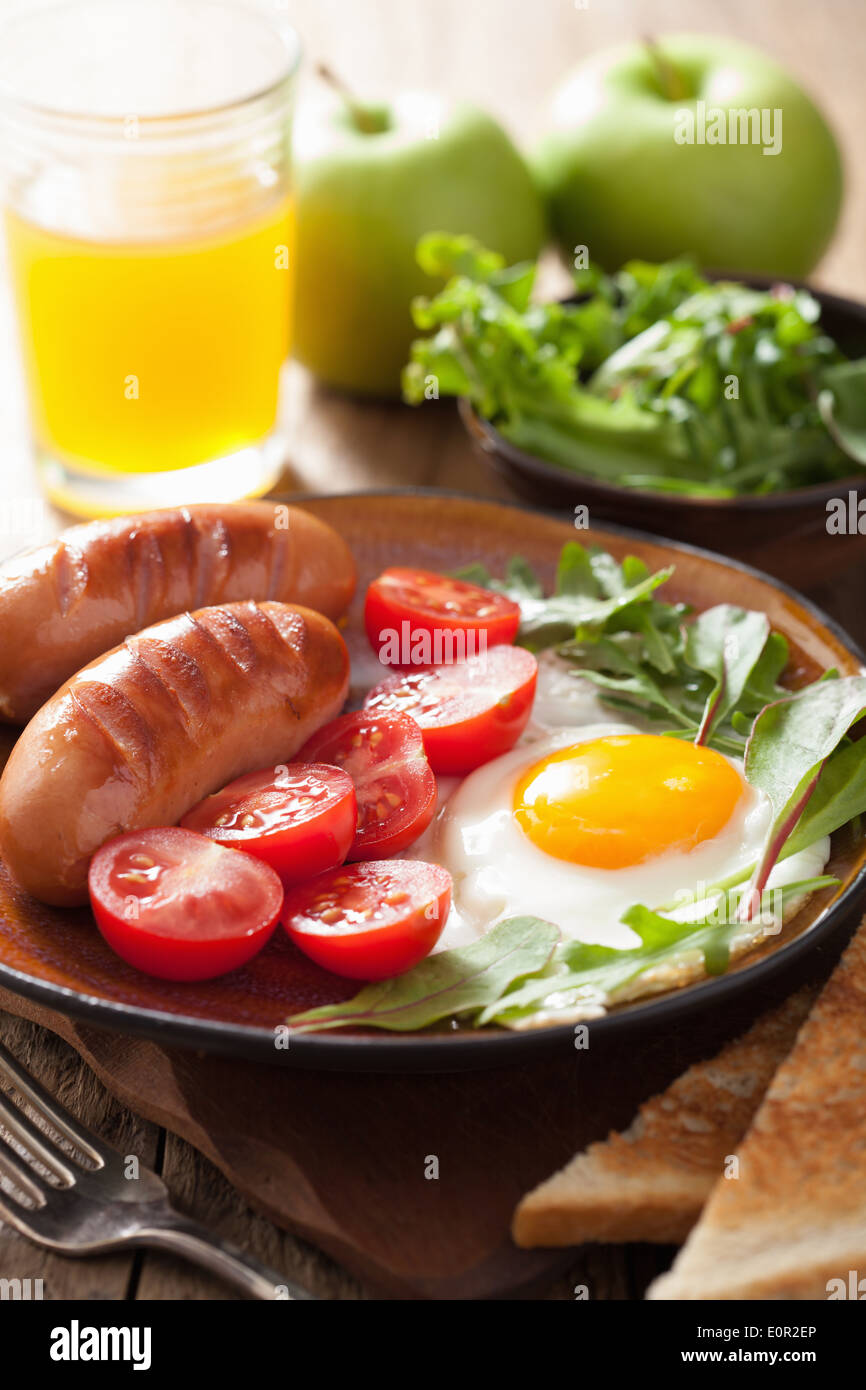 fried egg sausages tomatoes for healthy breakfast Stock Photo Alamy