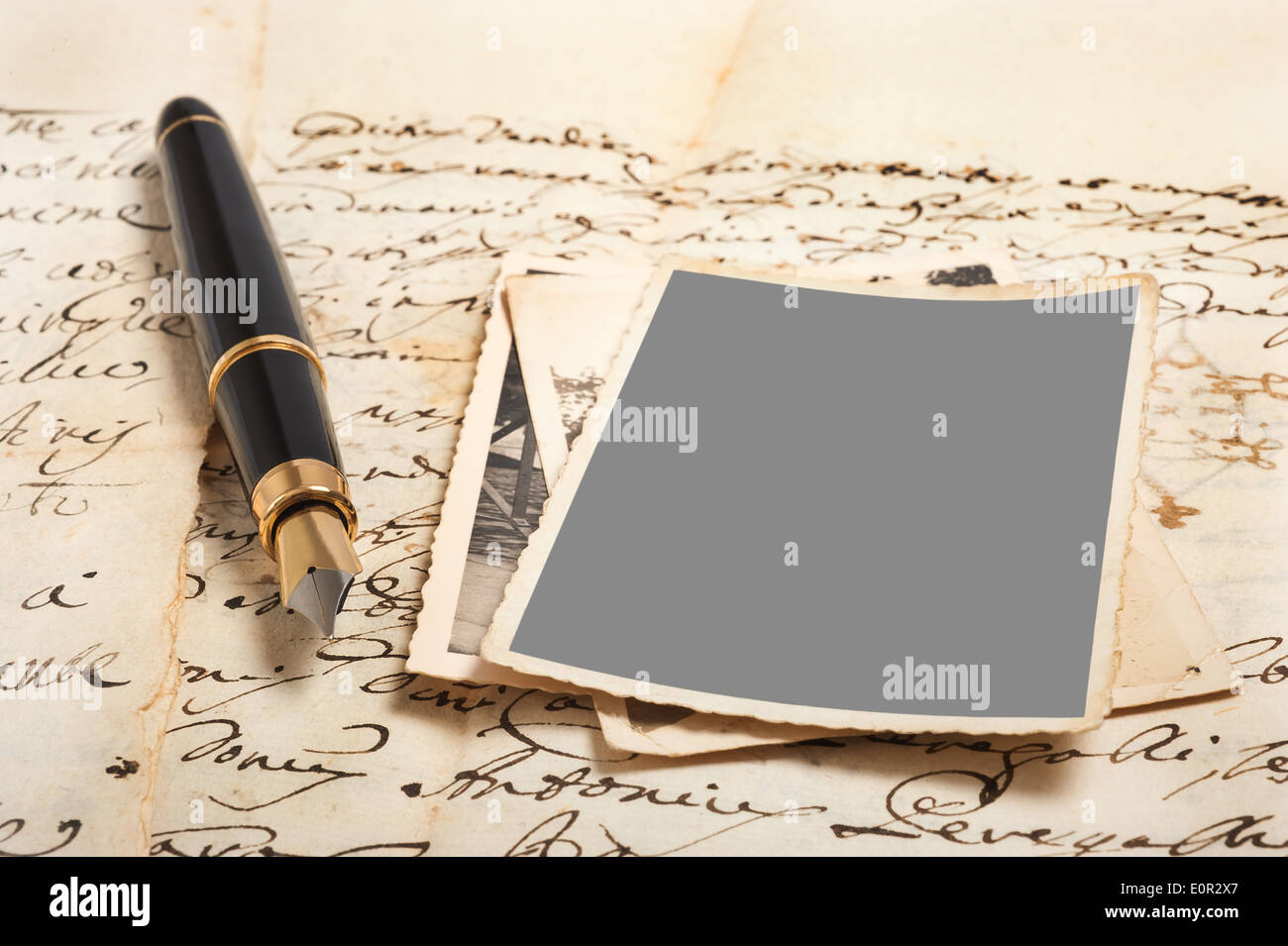 Fountain pen and pictures on old letters Stock Photo