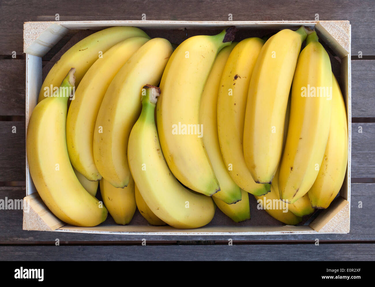 Wooden box of fresh bananas Stock Photo