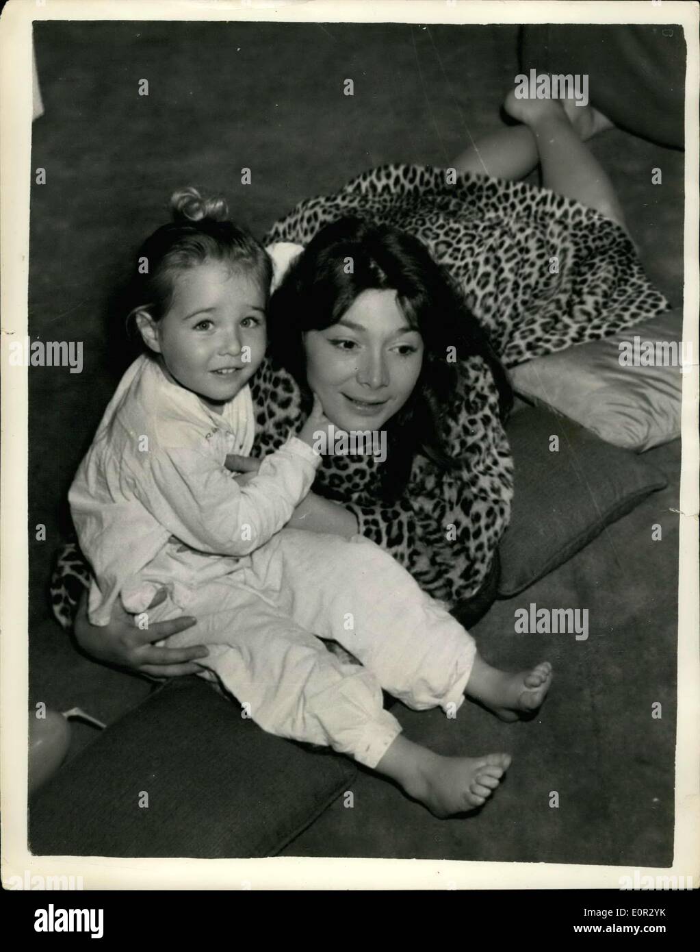 Oct. 31, 1957 - Existentalist Juliette Greco and her daughter: French singer Juliette Greco, High Priestess of Existentialism, has decided not to wait for tonight's premiere of her film ''The Sun also Rises''. True Mr. Darryl Zanuck had generously given her star billing alongside Ava Gardner and Tyrome Power for her seven minute-part in the 130 minute film. ''But'' she confessed, ''may part is really of no signifficance, so I'm off to Paris''. Staying with her at the Savoy Hotel is her 3-year-old daughter Laurence Stock Photo