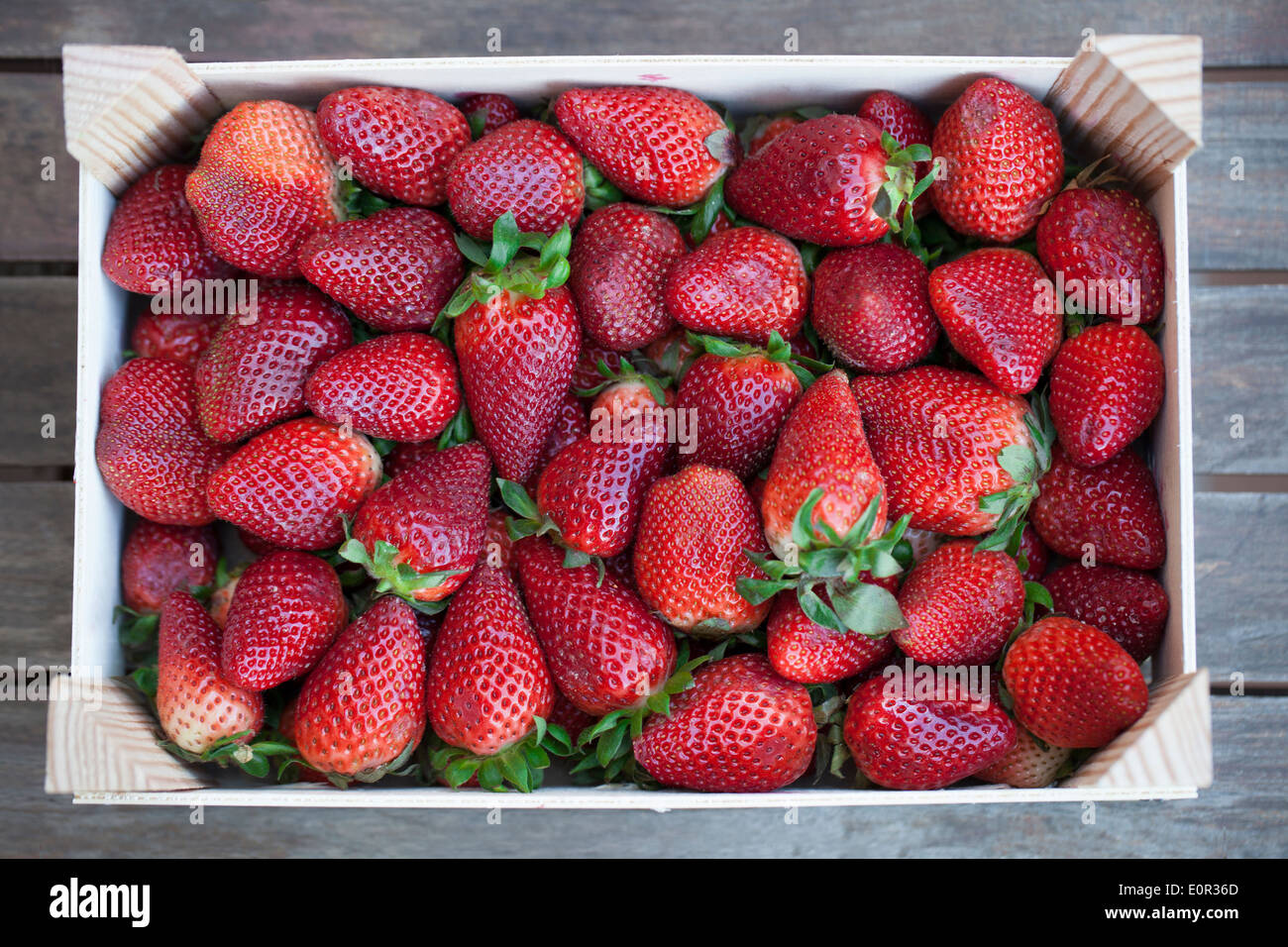 Wooden box of traditional strawberries from Palos de la Frontera, Huelva (Spain) Stock Photo