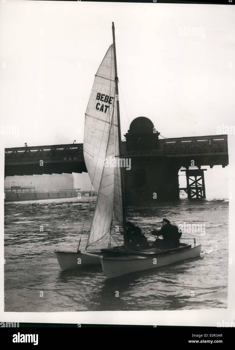 Jan. 01, 1958 - A Catamaran goes sailing on the River Thames, New ''Make it yourself'' craft demonstrated; A special type of Catarman a twin hulled Yacht - was to be seen sailing on the River Thames - after paying been ''launched'' by Lord Brabason of Tare from the Festival Hall pier this morning. The craft named ''Bebe cat' was soiled by its signer Captain Trick Manners and Miss Pamela Dugdale who has sailed many many miles in small boats. Photo Shows The Catamaran on the Thames showing the ''The hungerford Brides in background - this morning Stock Photo