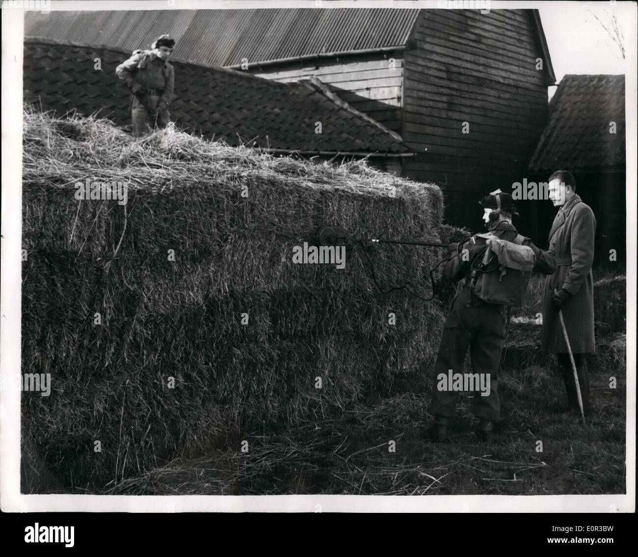 Jan. 01, 1958 - Mine Detectors Search For Murder Weapon: Men of the West Yorkshire searched with min-detectors at Bullsbank Farm, Eight Ash Green, near Colchester, for the weapon used to kill 19-year old Dutch girl, Mary Kriek, who was found in a ditch with her head battered. The dead worked for a month as a nurse maid at the farm and was seen on Sunday night leaving a bus near the farm. Photo Shows a mine detector being used in the search for the weapon, at Bullsbank Farm yesterday. Stock Photo