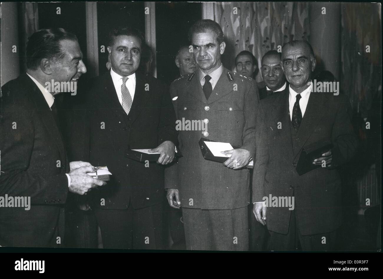 Nov. 11, 1957 - Dignitaries Receive Medals from Italian President the Italian consul general in Istanbul, Mr. Carlo Comile betewed today medals t high ranking officials of the city and university of Istanbul on behalf of President Gievanni Grench who recently paid on officials visit to Turkey.Istanbul. Stock Photo