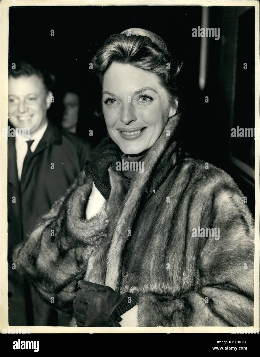 Nov. 11, 1957 - American Singing Star Arrives In London julie london At paddington: Julie London popular American singing star and her two children Lisa (5) and Stacy(8) arrived in London this morning- from the United States. She is to make her first British film here ''The Question of Adultery''. Photo shows. Julie London on her arrival at Paddington this afternoon. Stock Photo
