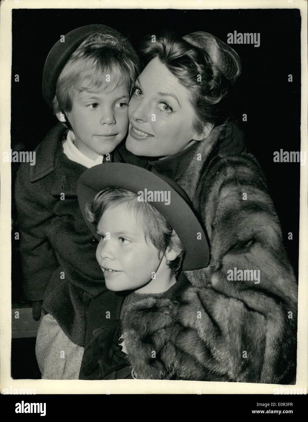 Nov. 11, 1957 - American Singing Star Arrives In London julie london At paddington: Julie London popular American singing star and her two children Lisa (5) and Stacy(8) arrived in London this morning- from the United States. She is to make her first British film here ''The Question of Adultery''. Photo shows. Julie London and children lisa (left) and Stacy on arrival at Paddington today. Stock Photo