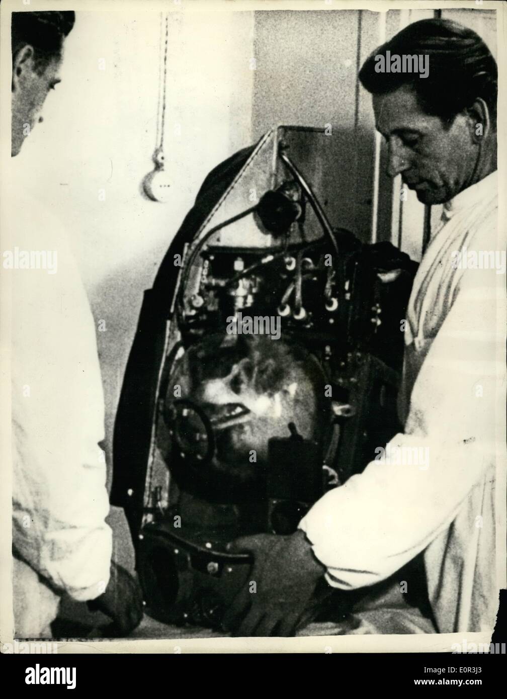 Nov. 11, 1957 - The Russian Satellite Dog Still Races Around The Orbit.. Experts Believe That It Cannot Be Returned To Earth. Experts believe that the dog now travelling around the orbit in the ''Sputnik II'' - Russia's latest Satellite - will die in space.. The ''Red Moon'' is cruising around the globe at 18,000 miles an hour - at between 200 and 500 miles above the earth.. The dog has been used in a number of space experiments by the Russian scientists. Stock Photo