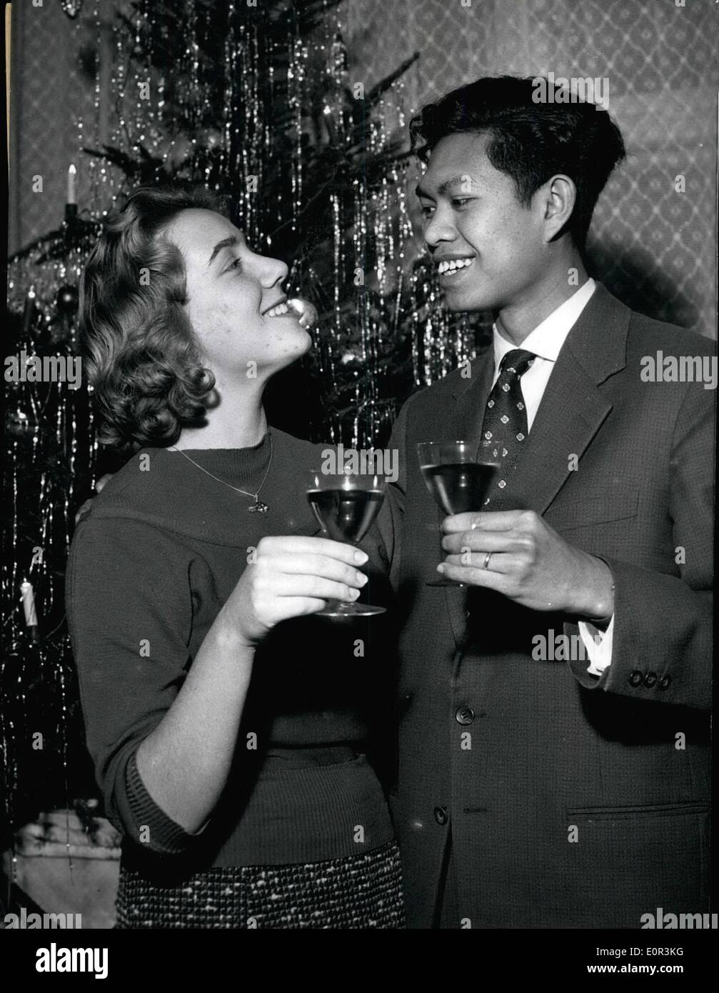 Jan. 01, 1958 - Berlin schoolgirl will become Bali-Princess: Under the Christmas tree the 18-year-old schoolgirl Hannelore Stuermer of Berlin-Reinicjendrof and Prince Udeyana Tisan of Puri-Singaradja/ Bali celebrated their engagement. They had met each-other for the first time an an International Jamboree during Easter in the Harz-mountains. A correspondence followed and a second meeting in summer during school-holidays. Last weekend they exchanged their engagement rings . Right now Hanelore is still going to school, but already in summer she will become Princess of Bali Stock Photo
