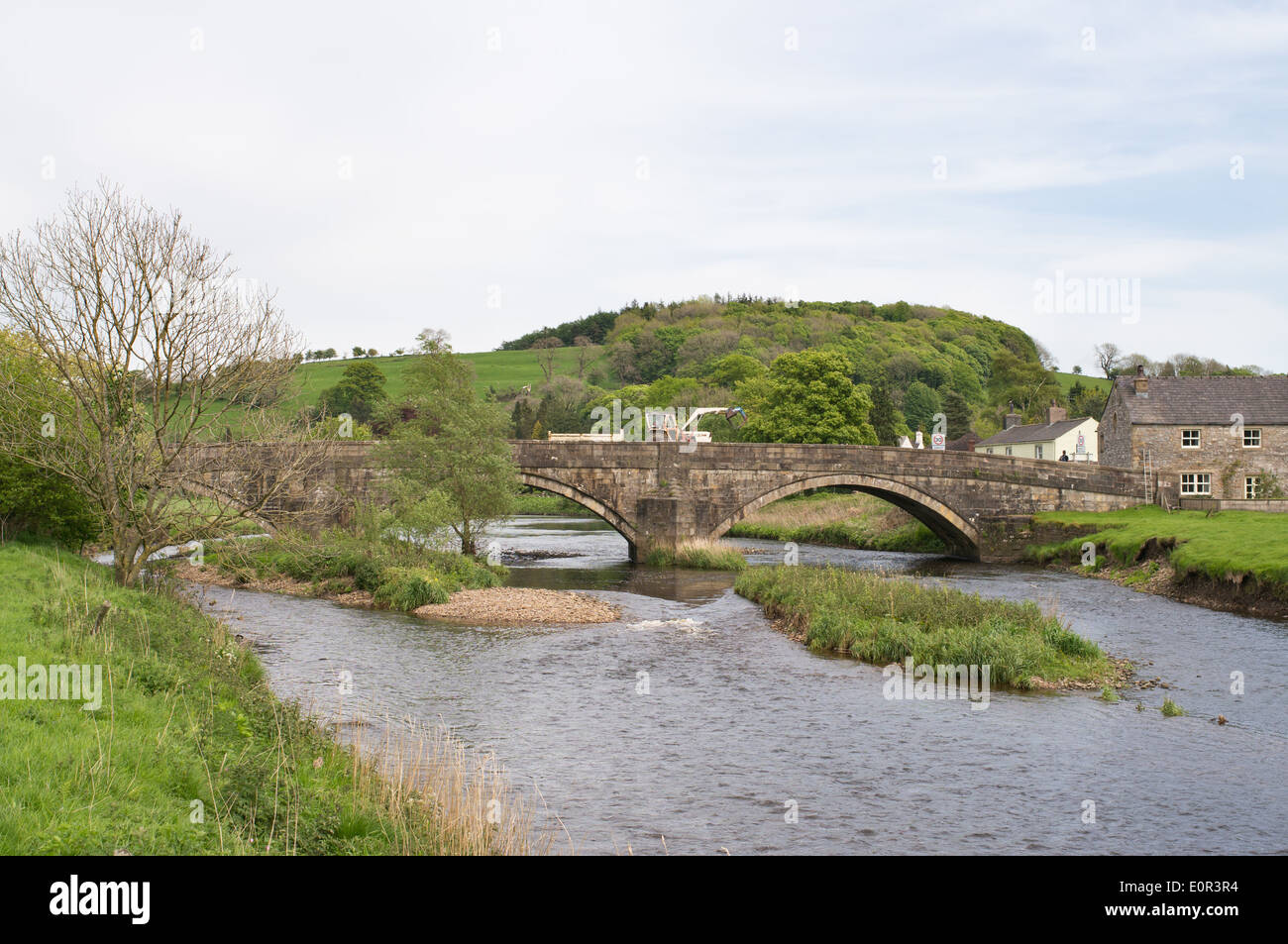 Tractor crossing bridge over river Ribble, Sawley, Lancashire, England ...