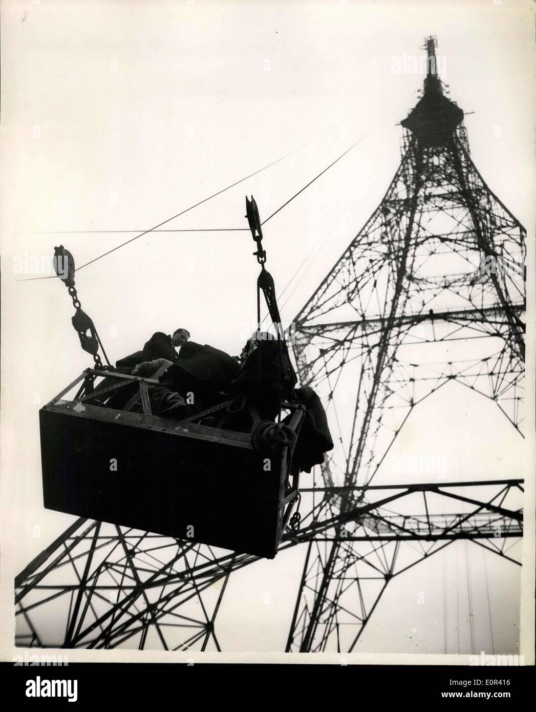 Nov. 20, 1957 - Testing the new B.B.C television mast with the aid of rockets at crystal palace: The new B.B.C Television Mast which is 709 ft. high underwent an aerodynamic test today when a battery of ten rockets mounted on the tower at a height of 625 ft. above ground level and fired in sequence. The rockets were a fixture and when fired each one created a thrust of half a ton. Any movement of the tower being recorded on electronic equipment in a mobile laboratory. The tests were conducted in conjunction with the National Physical Laboratory and the Royal Aircraft Establishment Stock Photo
