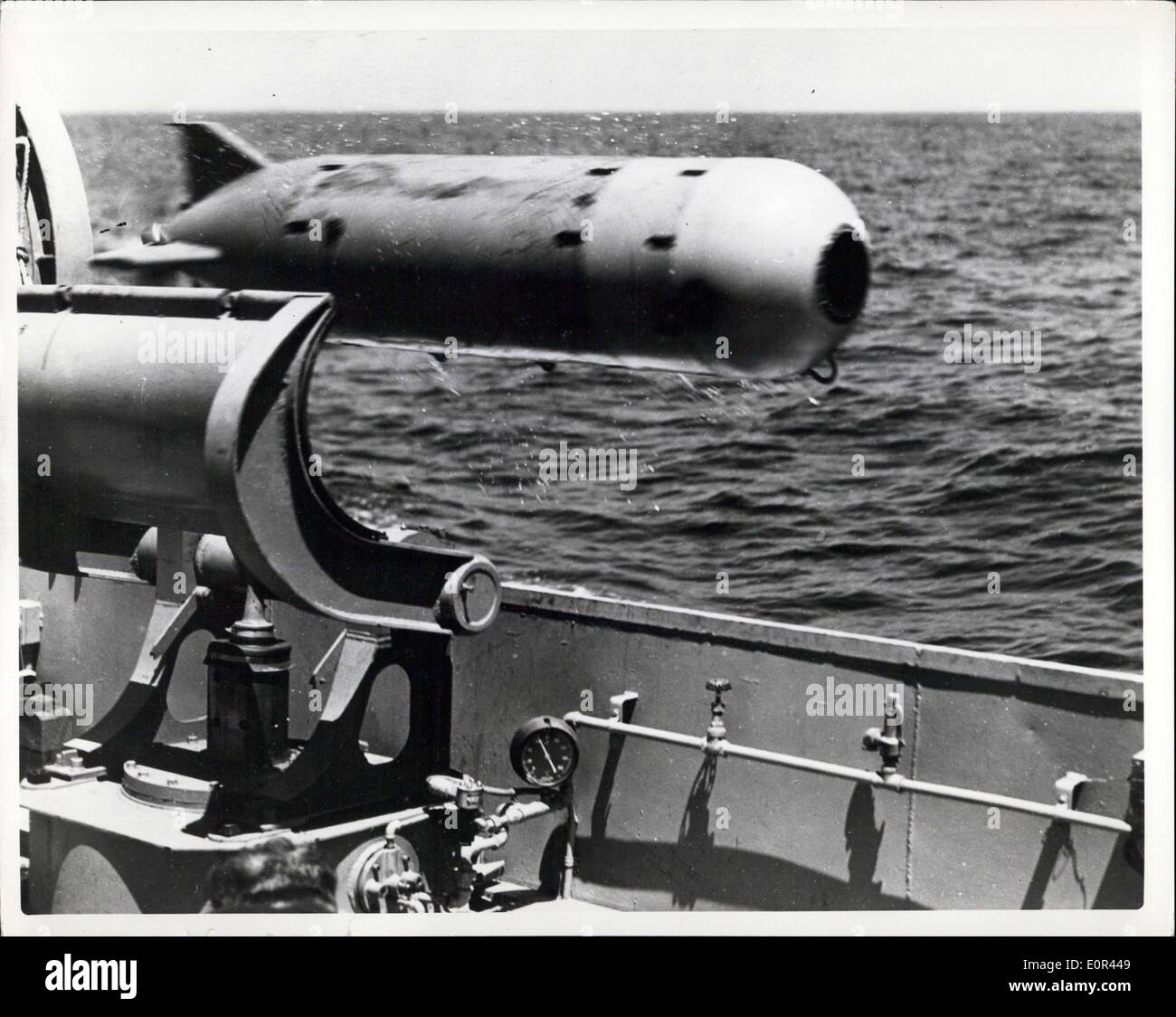 Jan. 15, 1958 - Leaving its Launcher, the Navy's latest acoustic-homing torpedo, the Mk 32, starts it relentless and unearing search for its target. Through its homing capabilities the torpedo is able to track down and sink any type submarine. A new acoustic-homing torpedo,the MK 32, has been developed by the U.S. Navy. Capable of tracking down and sinking submarines, the MK 32 is now in use with surface units of the fleet Stock Photo