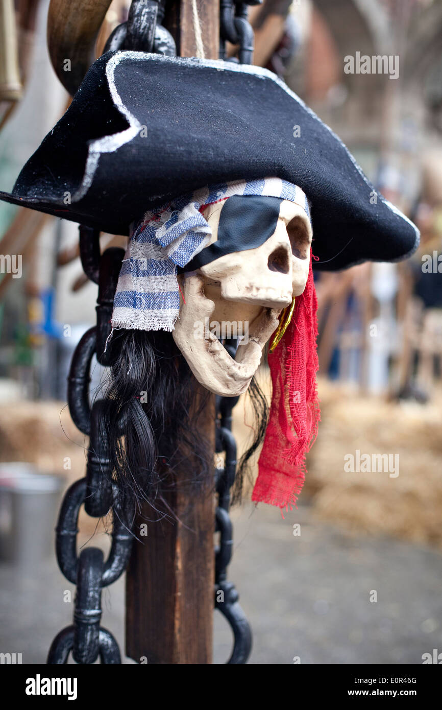 Cheerful pirate skull with wig and hat. Stock Photo
