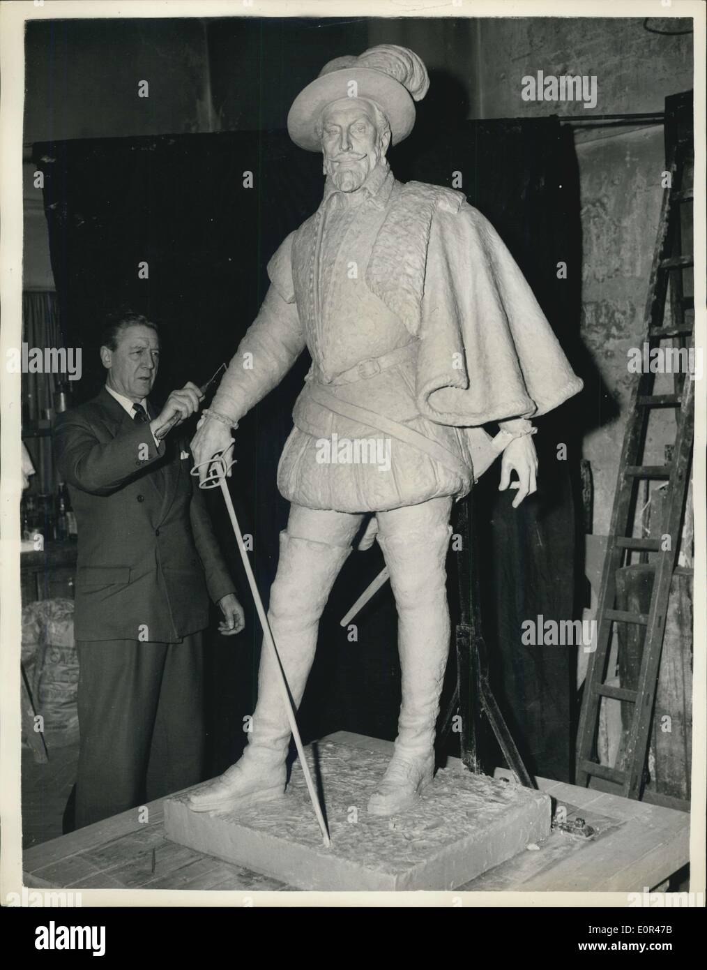 Nov. 29, 1957 - New Statue of Sir Walter Raleigh for London: Mr. William McMillan (70) the sculptor who produced the George VI Memorial overlooking the ~all is now putting the finishing touches to his new Statue of Sir Walter Raleigh which is to be erected in London next year. The state was commissioned by a group of Friends of the English Speaking Union is connection with the 350th. anniversary this year of Jamestown Virginia. Photo shows Mr. William McMillan with his almost completed statue at his London studio. Stock Photo