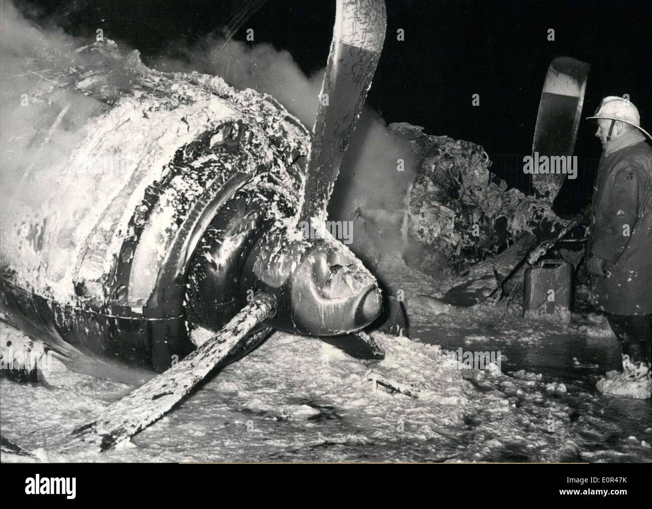 Dec. 02, 1957 - Firefighter Putting Out Plane Crash Flames at Orly 