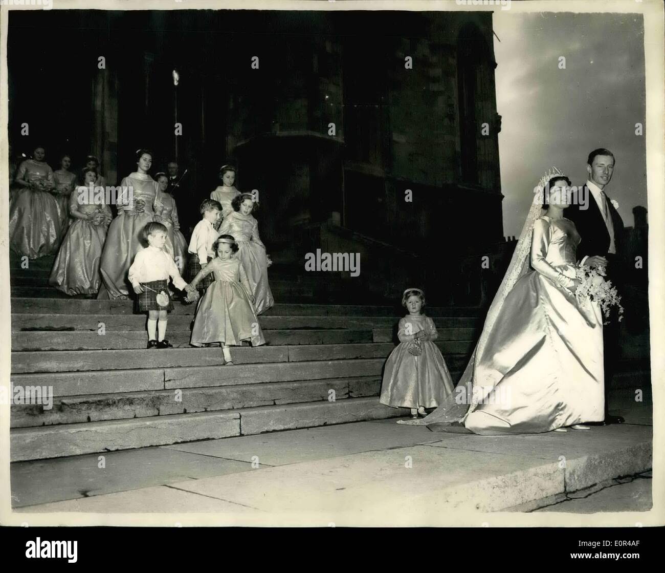 Dec. 12, 1957 - QUEEN'S COUSIN WEDS AT WINDSOR BRIDE AND BRIDEGROOM AFTER CERMONY The Wedding took place this afternoon at St. George's Chapel, Windsor of Miss Abel-Smith Cousin of the Queen - to Mr. David Liddell-Grainger..Princess Bestrix - Princess Trene of the Netherlands and Princess CHristina of Sweden were among the bridesmaids. KEYSTONE PHOTO SHOWS:- The Bride and Bridegroom with their attendants - including the Princess - leave the Capital after the wedding at Windepr this after noon. Stock Photo