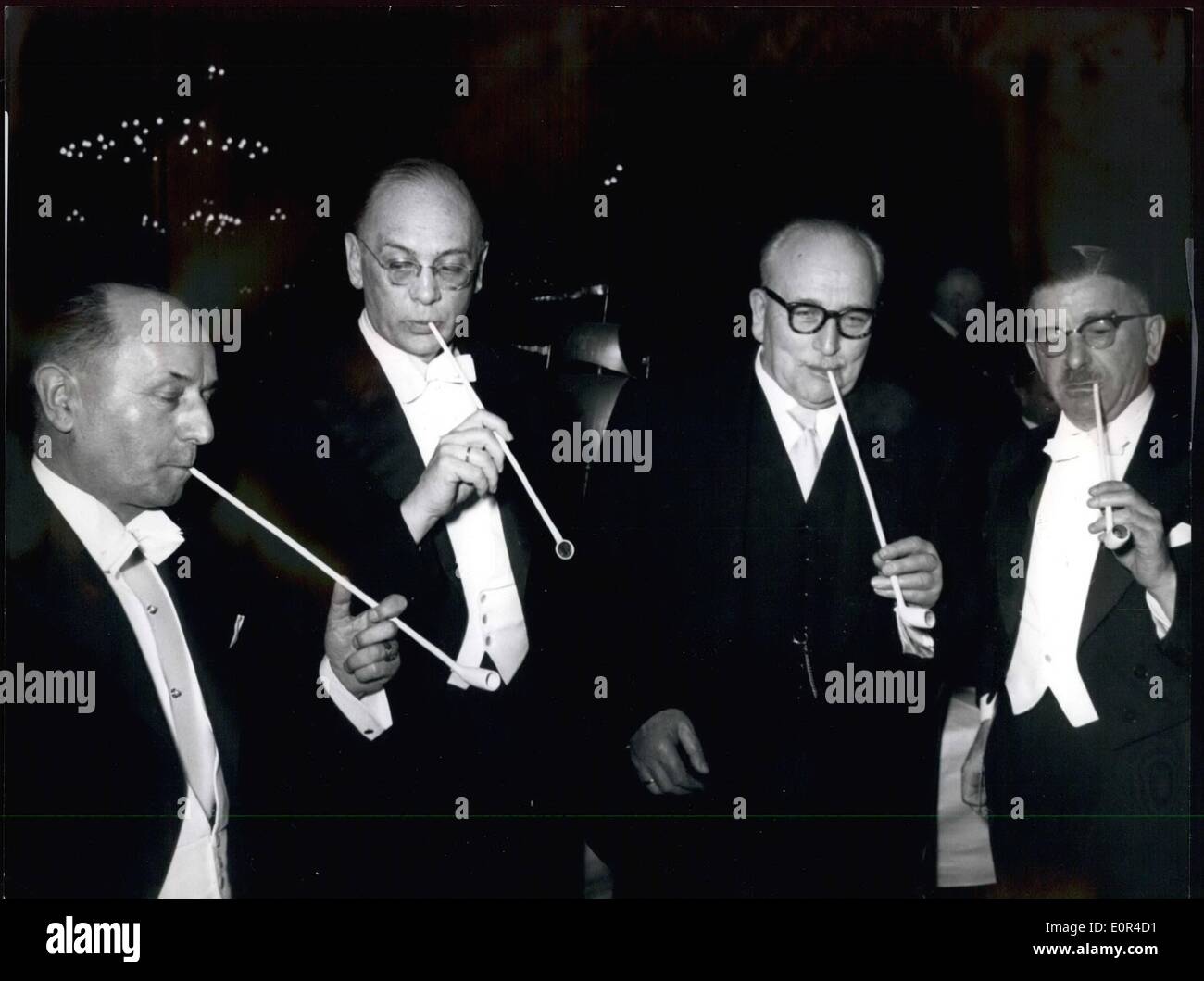 Feb. 02, 1958 - At the traditional ''Schaffer'' meal in Bremen... taking place at February 14, 58 in the old town hall, like every they were smoking out of long, pottery pipes. Our picture shows: from left to right side the Bavarian Prime Minister Dr. Hanns Seidel, the Federal Minister of Finances Franz Etzel, the senate's president of Bremen Kaisen and the Austrian Foreign Minister Dr. Leopold Figl. Stock Photo