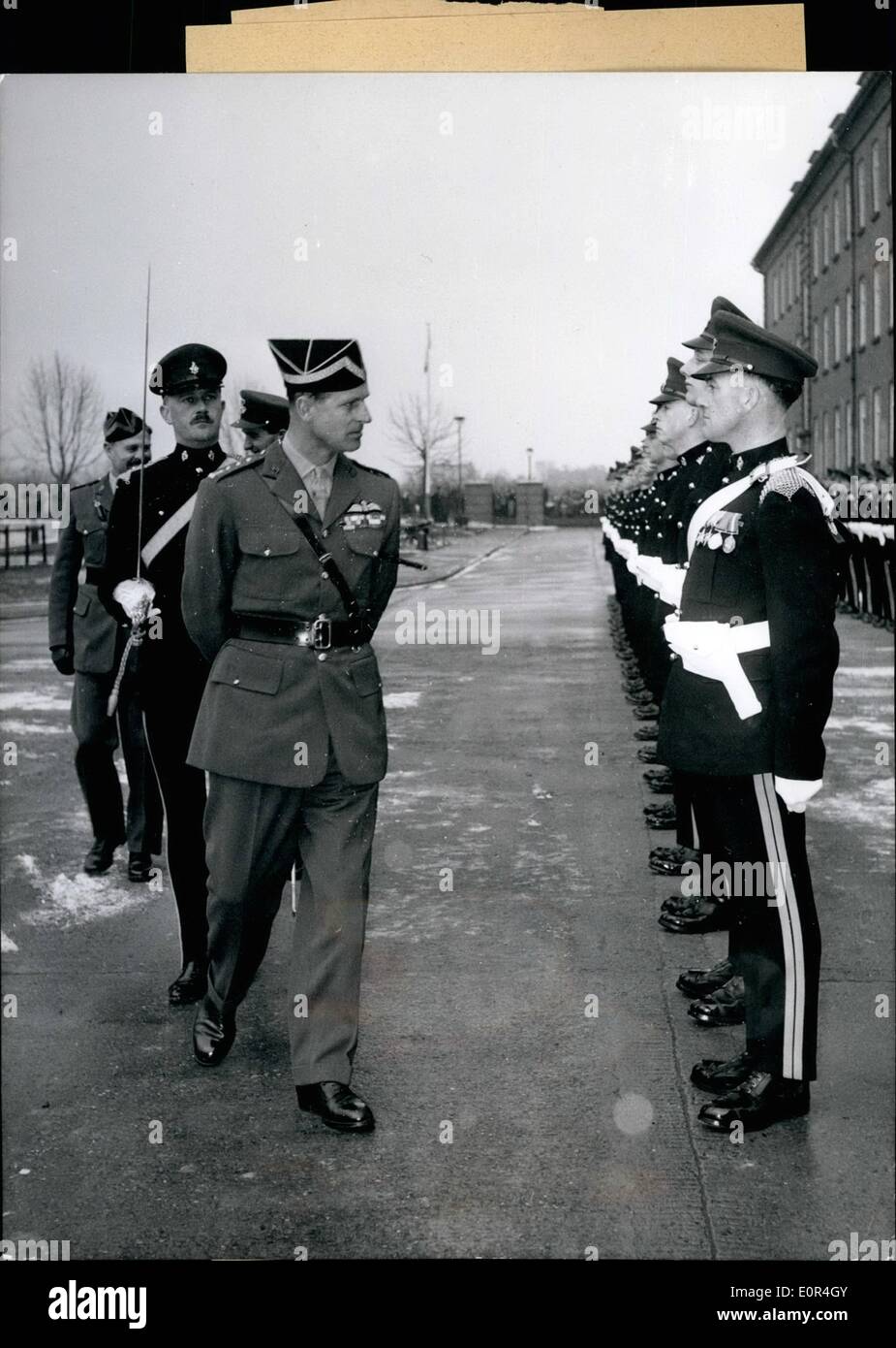 Mar. 03, 1958 - Prince Philip Visiting The 8th Irish Hussar Regimen: As chief of this regiment, His Royal Highness Prince Philip (Philip) at March 10, 1958 privately was visiting the 8th Irish Hussar regiment in the Wyvern barracks in Lineburg. He also was looking at the drilling districts of tanks. Photo Shows Prince Philip walking along the honour company. Stock Photo