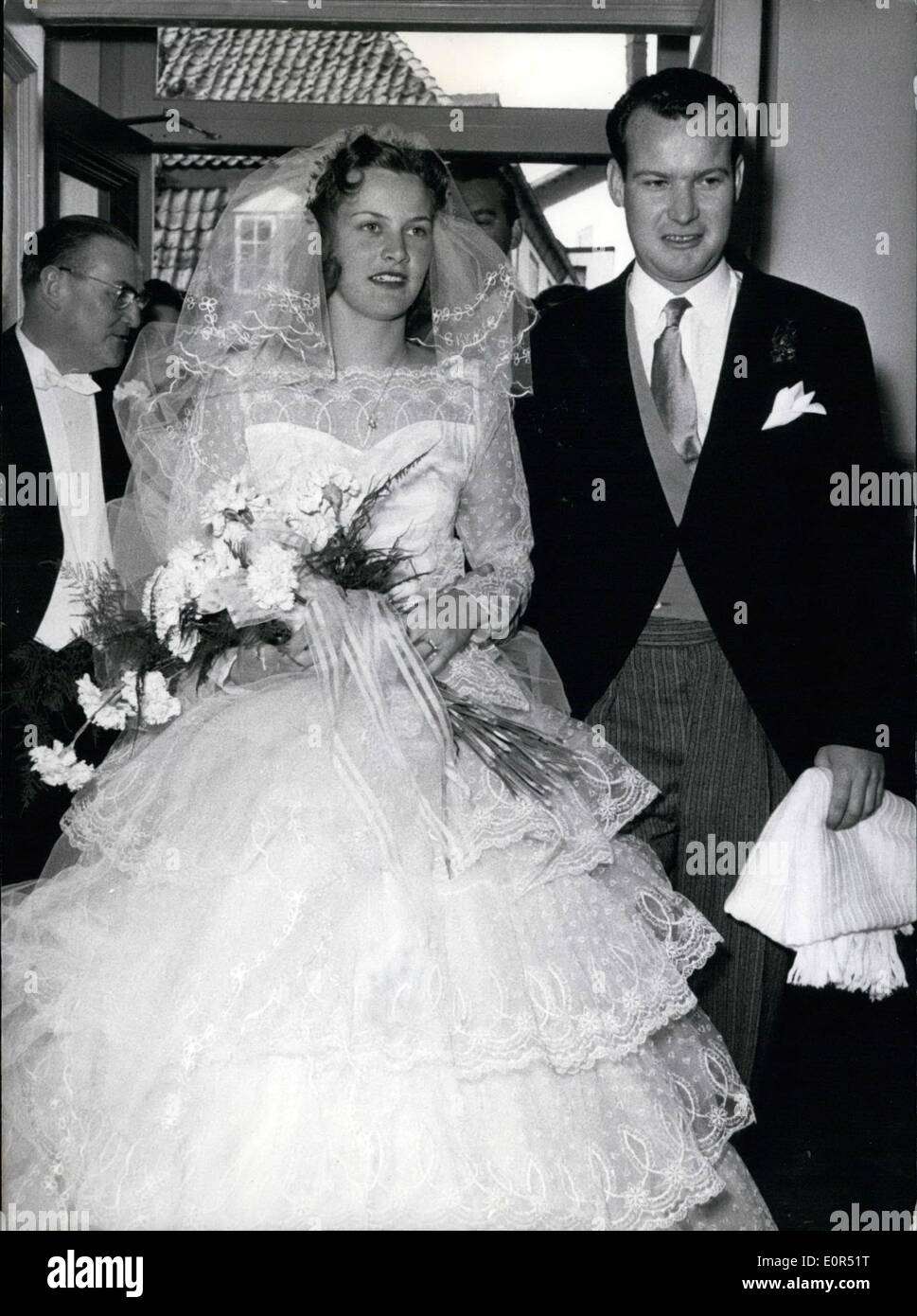 Mar. 03, 1958 - The ecclesiastical wedding; of the couple Christiane Botsh and the Canadian millionaire Harry Philip Oakes was celebrated on Saturday, 22-3-1958, at Hamburg Othmarschen. Photo Shows From Left to right the bride father Butcher Botsch, the bride Christiane Botsch and the bride groom Harry Philip Oakes. Stock Photo