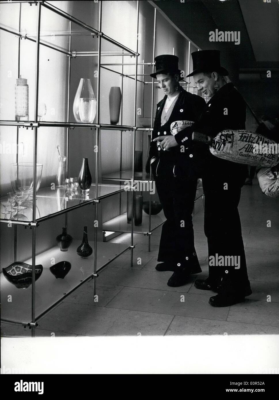 Feb. 02, 1958 - Carpenters of Hamburg admirers of fine glass-ware To the first guests and admirers of beautifully formed glass-ware of the Italian glass blower factory Venini-Murano and the Swedish glass blower factory Orrefors, exhibited in the Munich Chamber of Craftsmanship. Two carpenters of Hamburg were belonging, our picture. Stock Photo