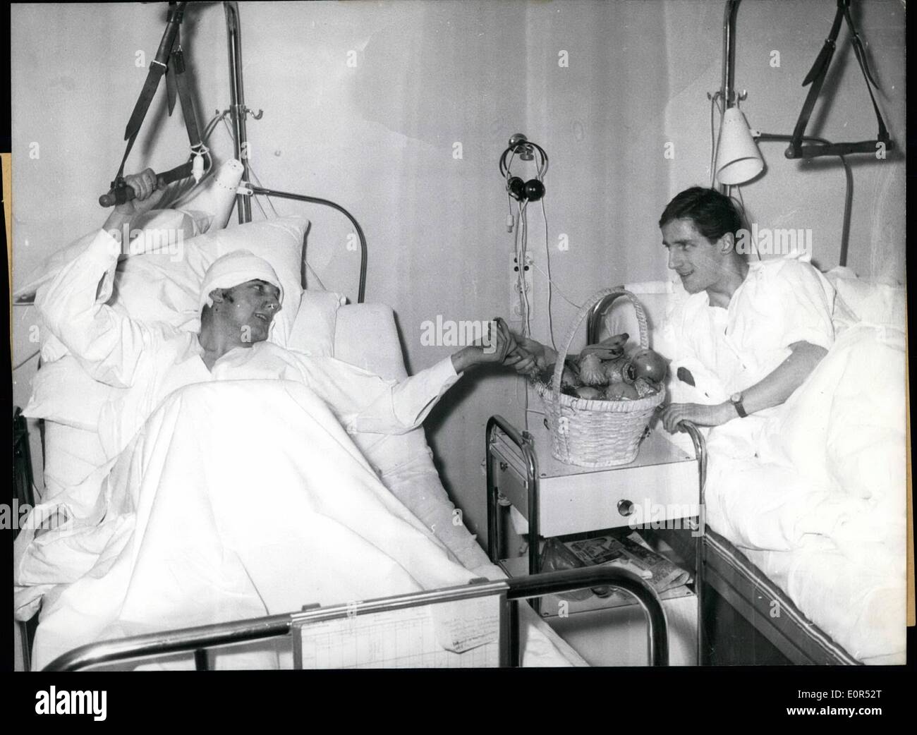 Feb. 02, 1958 - In the hospital at the right side of the Isar in Munich several injured members of the foot ball team Manchester United, injured at the aircraft's catastrophe at February 7,58 in munches- rime, already are on the way of recovery. Picture 1, Kwan Morgan sitting in a wheel chair on the way to the X-rays. Picture 2, Bobby Charlton already is drinking out of a genuine Bavarian beer - tankard. picture 3 , wood Raymond (left side) and Bobby Charlton(right side) already are able to laughs Stock Photo