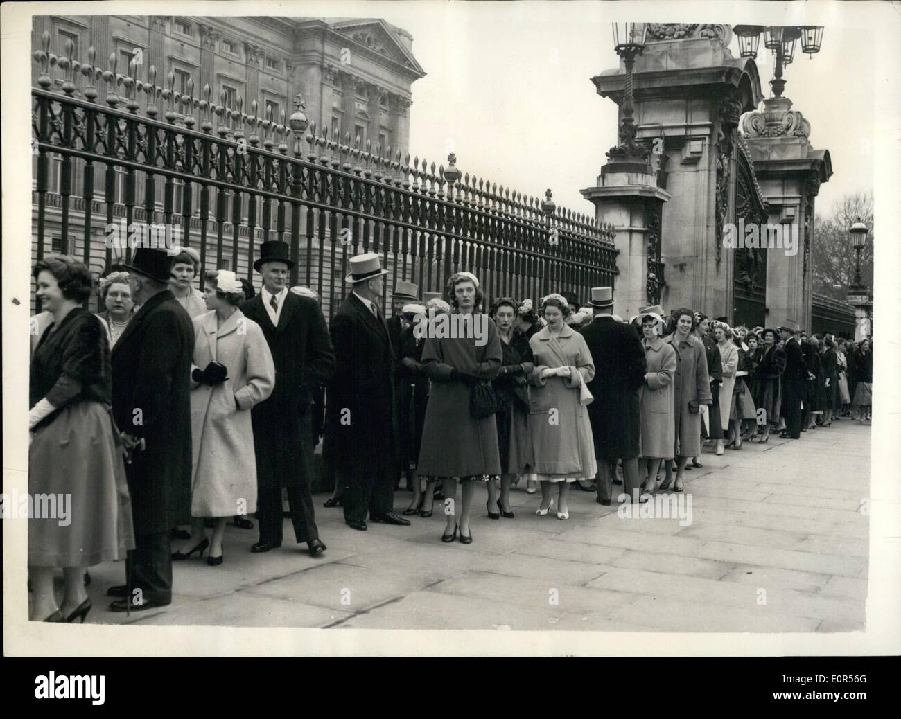 Mar. 03, 1958 - Palace Presentation party. Queue outside the gates.: Photo shows Palace visitors waiting to enter the gates - for the Buckingham Palace presentation party this afternoon. Stock Photo