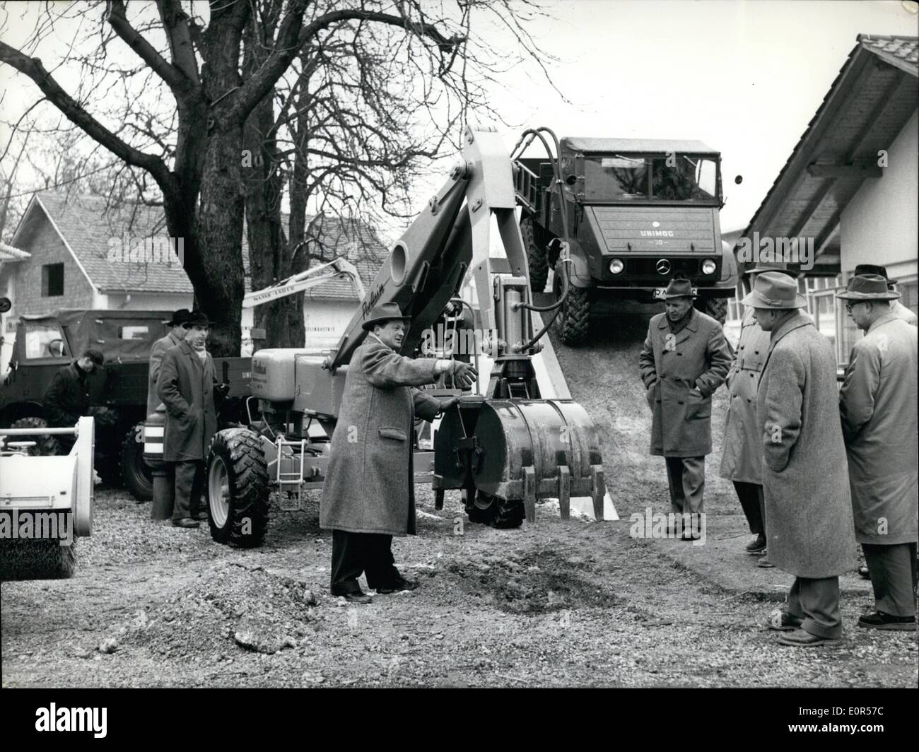 Mar. 03, 1958 - Pre-Picture for the building machines exhibition in Munich from March 22, to March 30. On the Bauma in Munich for the first time a dredger will be shown, specially developed for the Unimog. Only during a few seconds the dredger - may e fixed and loosened to the Unimog. A special advantage is the driving speed of about 40 kmph., stoppage of traffic doesn't exist. Our picture shows:- The Poclain-dredger, fixed to an Unimog, on the Bauma. Right side the obstacle distance with a descent of 55% Stock Photo