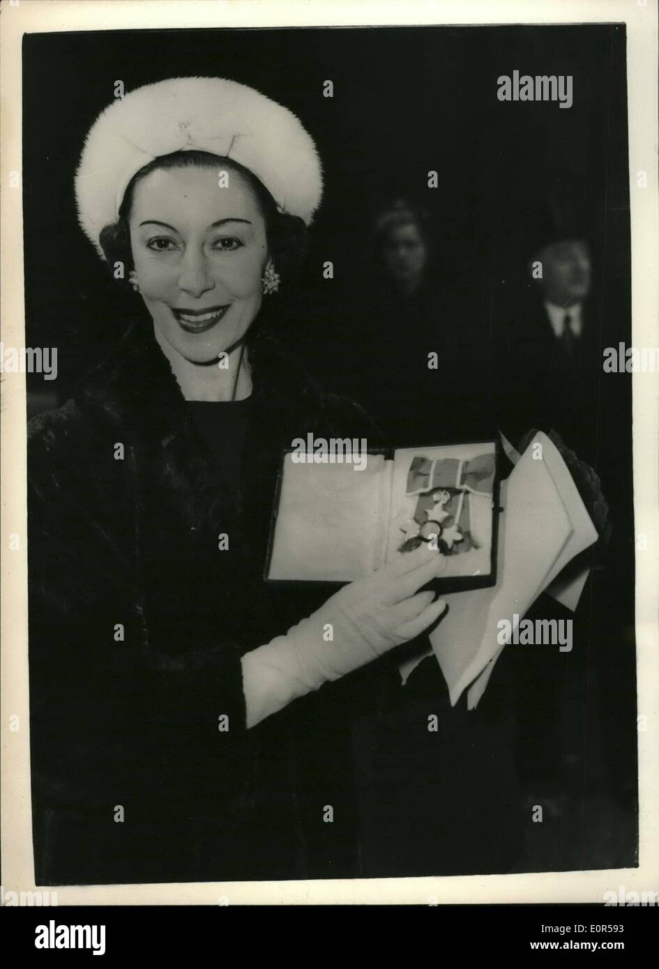 Mar. 11, 1958 - 11-3-58 Alicia Markova receives the C.B.E.. Prima ballerina Alicia Markova holds the insignia of the C.B.E. (Commander of the Order of the British Empire) as she leaves Buckingham Palace today after attending the investiture held by H.M. The Queen. Stock Photo