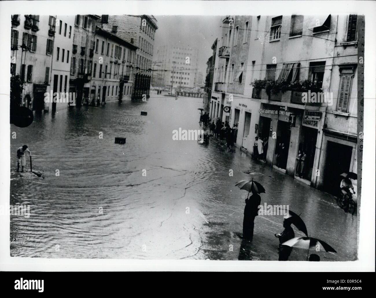 Mar. 03, 1958 - Violent Cloudbursts Cause Widespread Floods In Italy.. Main Street Of Brescia - Under Water. Many parts of Italy were flooded - following violent cloudbursts which caused rivers to overflow.. One of the worst hit places was the town of Brescia.. Keystone Photo Shows:- General view of the main street in Brescia after the overflowing of the River Garza. Through this street normally passes traffic for Milan -- Triente - Venice - Cremona etc. Stock Photo