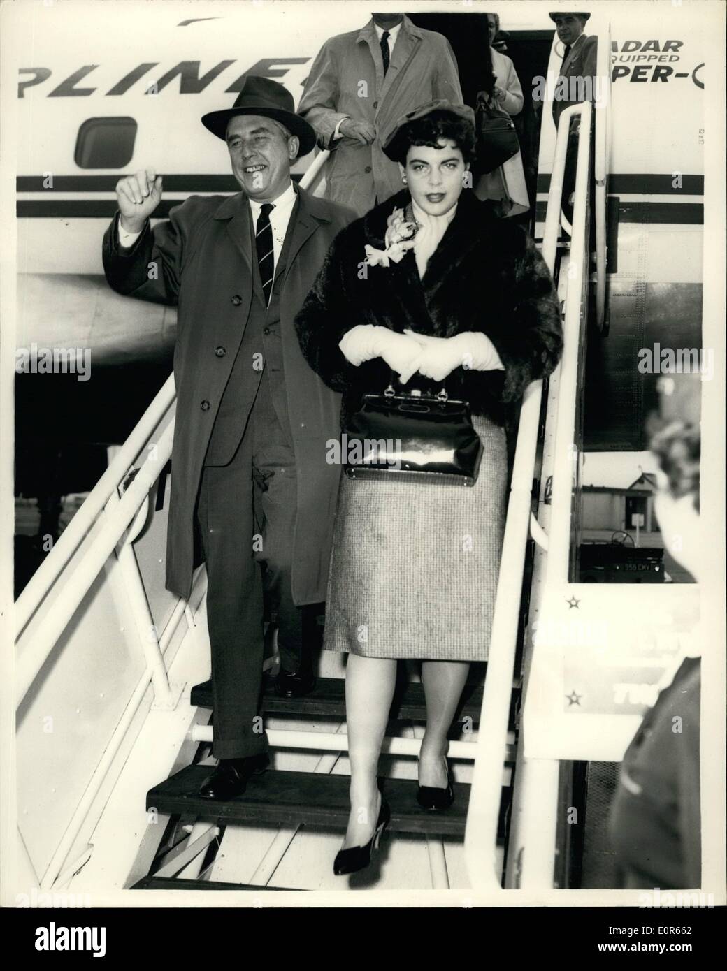 Apr. 04, 1958 - Governor of the New Jersey arrives: the Hon. Robert B. Meyner, Governor of the State of New Jersey, arrived at London Airport from America today. He is visiting England in connection with the opening of the Port of New York Authority's London Trade Development Office. Photo shows Robert B. Meyner and his wife, Helen, pictured leaving the aircraft on arrival at London Airport today. Stock Photo