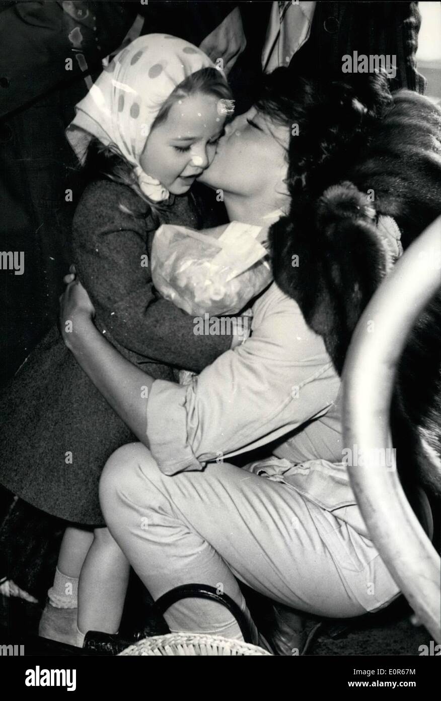 Apr. 04, 1958 - Juliette Greco: Back from Africa: Juliette Greco who is starring in ''Racines Du Ciel'' (The Roots of Heaven) just completed in Equatorial Africa arrived at Orly Airport this morning. Photo Shows Juliette Greco kissing her little daughter after alighting from the plane this morning. Stock Photo