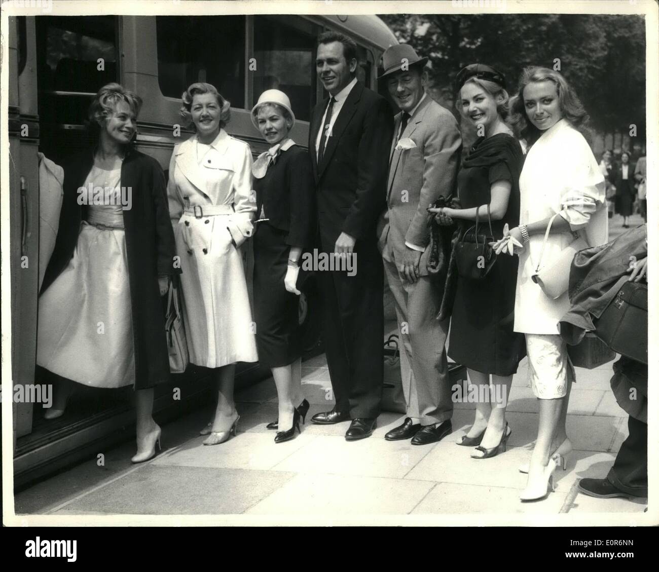 Jun. 06, 1958 - Stars Leave For Monte Carlo Film Premiere: A number of well known stars left London this morning for Monte Carlo - to attend the gala premiere of the Sinatra film ''Kings Go Forth'' - to be attended by Prince and Princess Rainier of the Monaco. The gala show is in aid of the U.A. Refugee Fund for Children. Photo Shows Getting into their coach for the airport at the Orchestrator this morning - L-R:- Mai Zetterlilg.Mrs. Howard Keel; Mrs. Michael Wilding; Howard Keel; Michaewl Wilding; Delphi Lawrence and April Olrich. Stock Photo