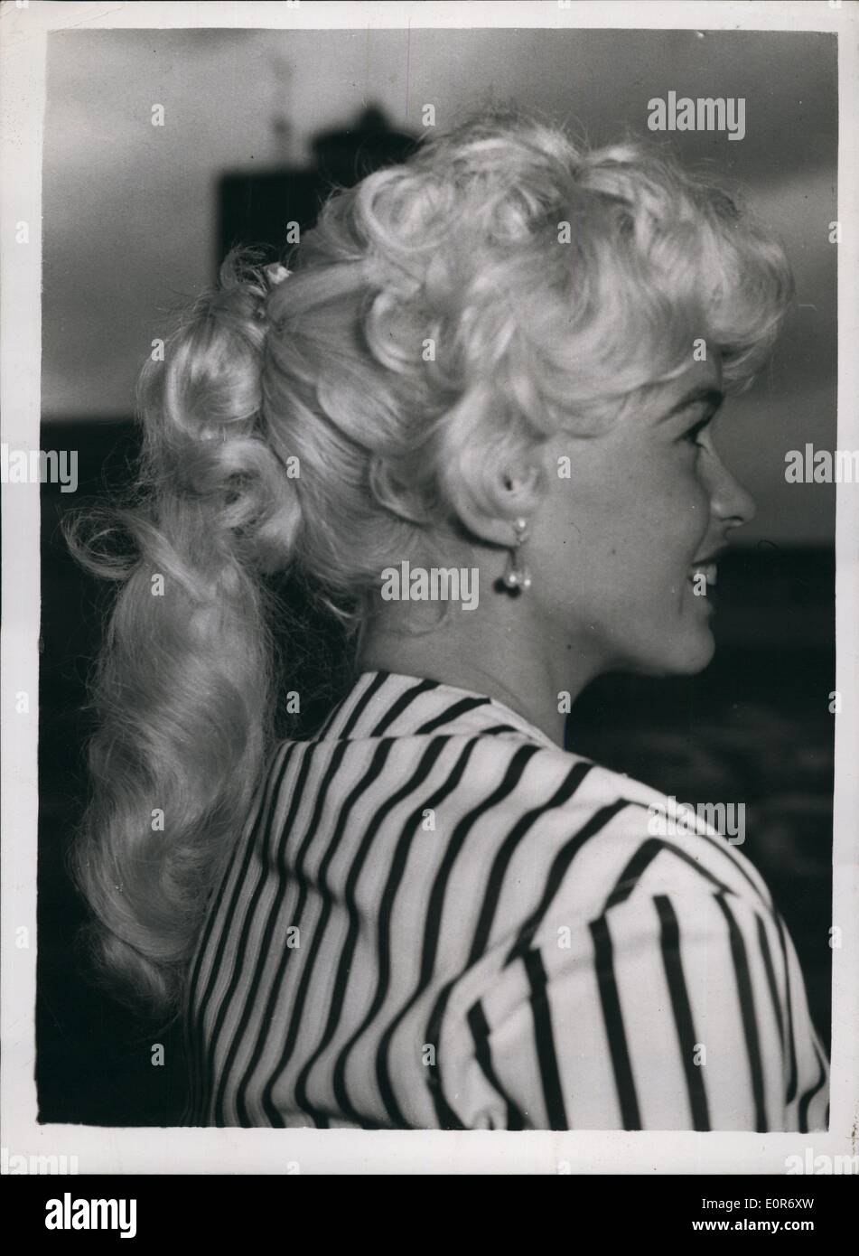 May 05, 1958 - Jayne Mansfield And Husband Fly To Cannes Film Festival: Leaving London by air today was American film star Jayne Mansfield who is flying to Cannes to attend the film festival. She was accompanied by her husband Micky Hargitay. Photo shows Jayne Mansfield - with her ''Horsey'' hair style - as she left London airport this morning. Stock Photo