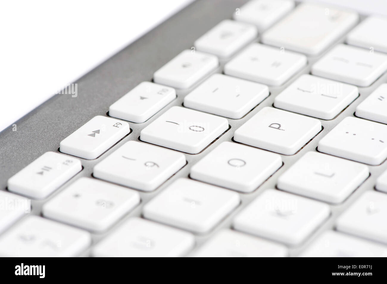 Apple mac white Keyboard focused on the number 0 Stock Photo