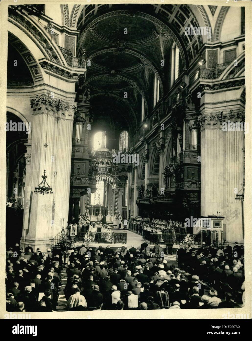 Jun. 06, 1958 - Queen attends dedication at St. Paul's: H.M. the Queen and the Duke of Edinburgh today attended a service for the re-dedication of the restored eastern part of St. Paul's Cathedral and the dedication of the new High Altar as a memorial to the 335.451 men and women of the Commonwealth overseas who died in the two world wars. Photo shows the Archbishop of Canterbury during the Consecration showing the Queen and the Duke of Edinburgh seated at St. Paul's Cathedral today. Stock Photo