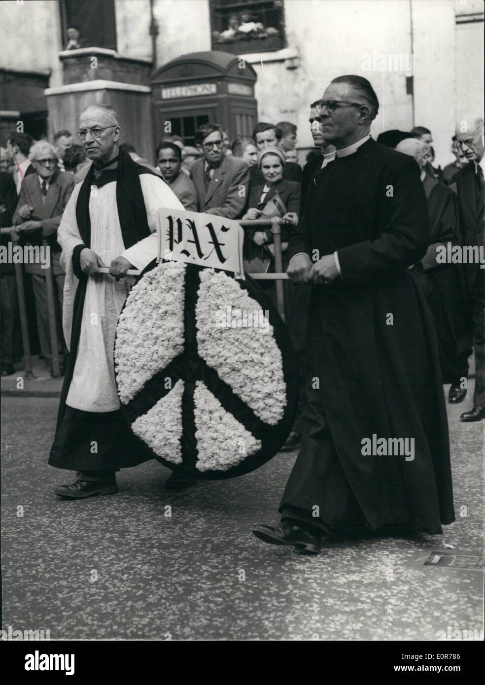 May 05, 1958 - Mass Lobbying Of M.P.'s At House Of Commons.. Clergymen At Wreath Laying Ceremony. Organised by the Nuclear Disarmament Mass Lobby Committee - people of all parts of the country this afternoon went to the House of Commons to 'lobby' their M.P.'s against the testing - manufacture - and storing of Nuclear weapons by Britain. Photo Shows L-R Father Jack Putrill and Dr. Soper carrying a wreath to the Centotaph - prior to taking part with about 100 other Clergymen in the ''Lobbying'' at the House of the  this afternoon. Stock Photo