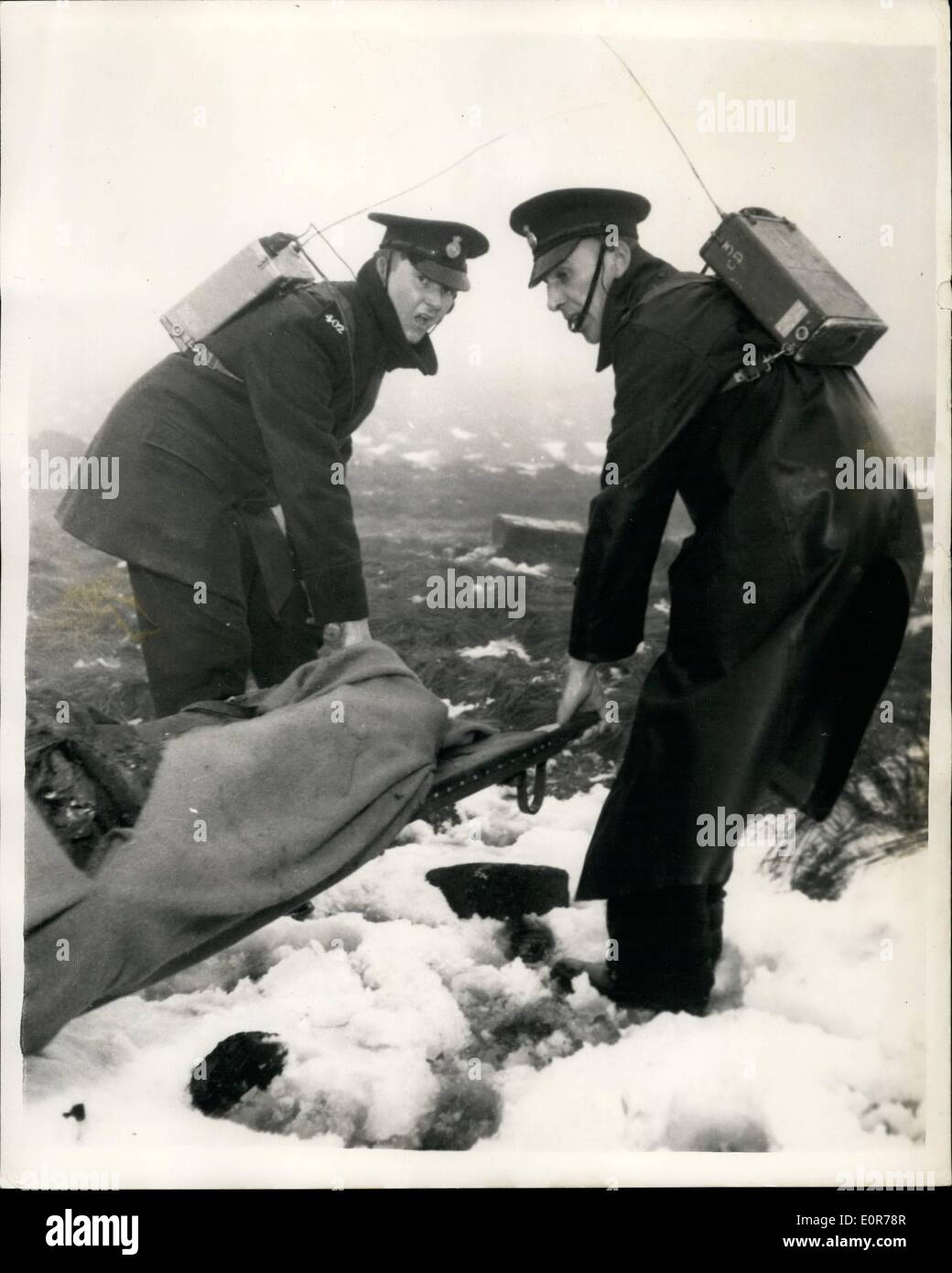 May 05, 1958 - Thirty five die in day trip plane disaster in Lancashire. Thirty five happy men, looking forward to a day out, died as they joked yesterday when their airliner crashed in fog into Lancashire's ''TV Mountain'', winter Hill , near Bolton. The Plane , a Silver City Airways Wayfarer , crashed just below the peak of the hill. Seven survived the crash, including the crew of the three. The passengers , motor traders from the Isle of Man, were on their way to spend the day as the guests of a battery factory in Manchester Stock Photo