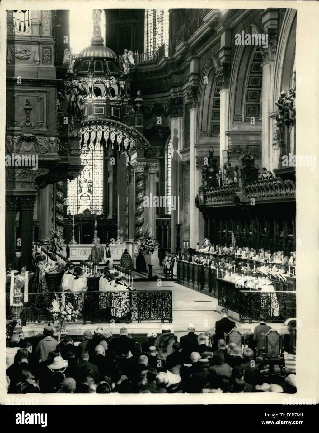 May 05, 1958 - Queen attends Dedication at St. Paul's: H. M. the Queen and the Duke of Edinburgh today attended a service for the re- dedication of the restored Eastern part of St. Paul's. Cathedral and the dedication of the new high altar as a memorial to the 235,451 men and women of the Commonwealth Overseas who died in the two world wars. Photo shows the scene in the Cathedral during the blessing by the Archbishop of Sanserbury showing the Queen and the Duke of Edinburgh seated at prayer. Stock Photo