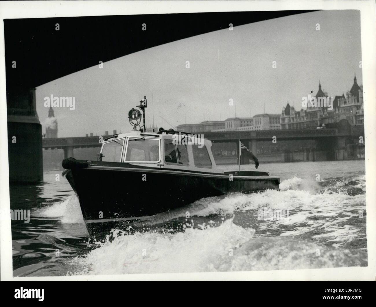 May 05, 1958 - NEW FIBRE GLASS POLICE LAUNCH. A new fibre glass Police launch was handed over for today at the Waterloo Police Pier. It is 30-feet long and powered by a Diesel engine, with a speed of 12 5/4 knots. It is moulded in two halves and bolted to an alluminium alloy keel. Keystone Photo Shows:- View of the new fibre glass police launch, seen at speed after being handed over for duty today. Stock Photo