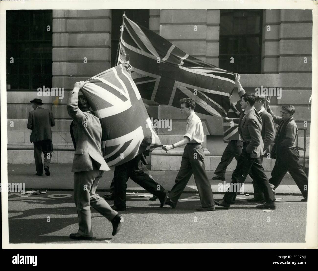 May 05, 1958 - Red Flag Flies From St.Pancras Town Hall. Students Demonstrates With Union Jacks. The Socialist majority on St, Pancras Borough Council decided last night to fly the Red Flag over St.Pancras Town Hall and to give all Council workers the day off. Students carrying Union Jacks demonstrated outside the Town Hall. keystone Photo show:- Students carry Union Jacks as they demonstrate outside St.Pancras Town Hall. Stock Photo